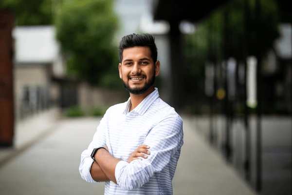 handsome-smiling-young-man-folded-600nw-2066727893